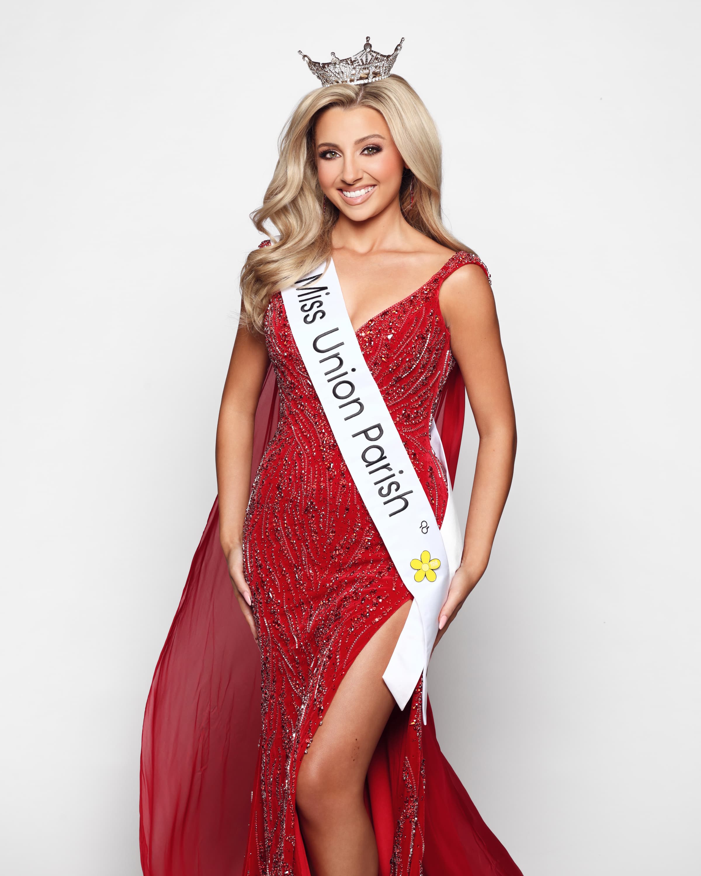Hannah Brotherton as Miss Union Parish, in a red gown with her crown and sash